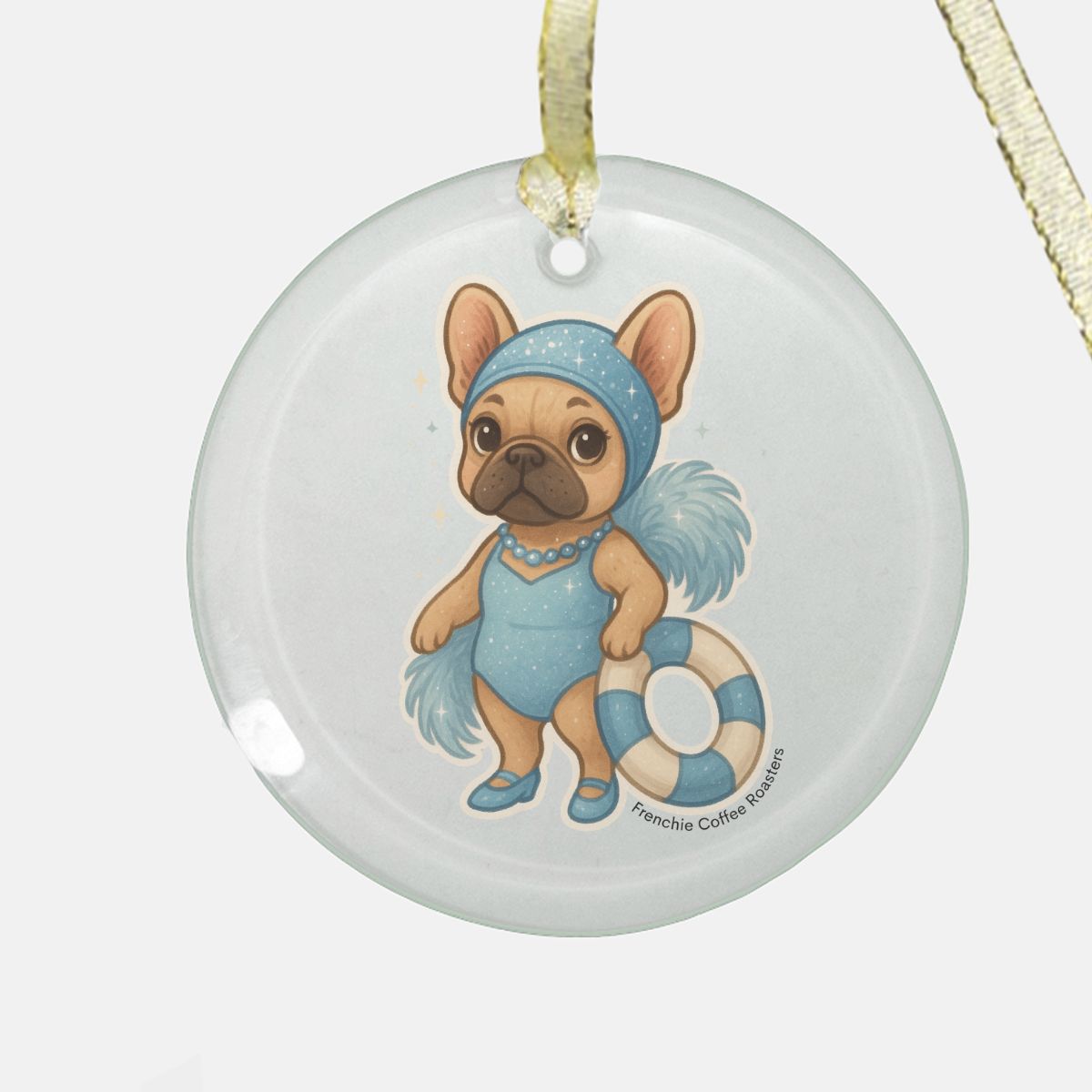 A clear round glass ornament featuring Swimming Ophelia, a whimsical French Bulldog character from Frenchie Coffee Roasters, dressed in a sparkling blue vintage swimsuit with feathers and pearls.