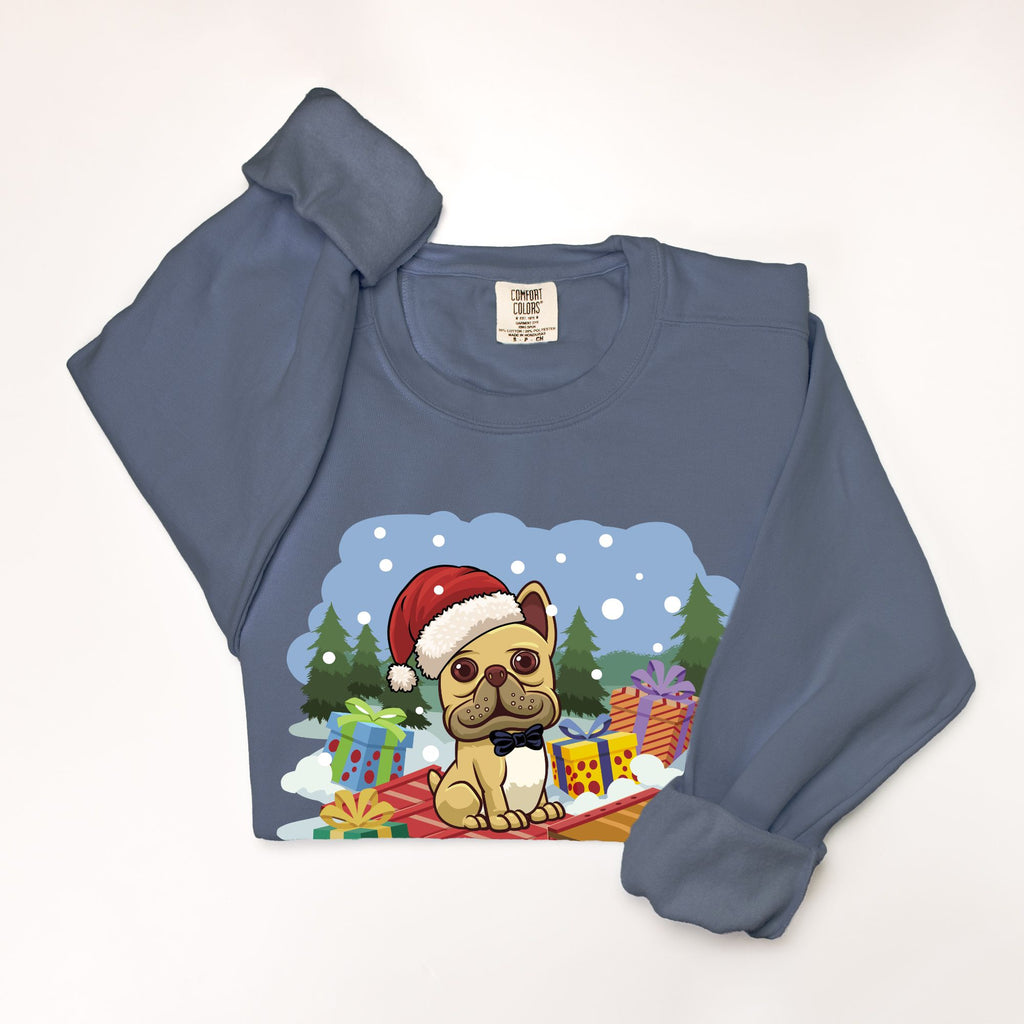 French Bulldog wearing a Santa hat sledding through snow on a blue crewneck sweatshirt from Frenchie Coffee Roasters holiday collection